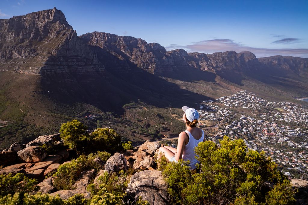 A viewpoint looking over the city of Cape Town from a cliff edge