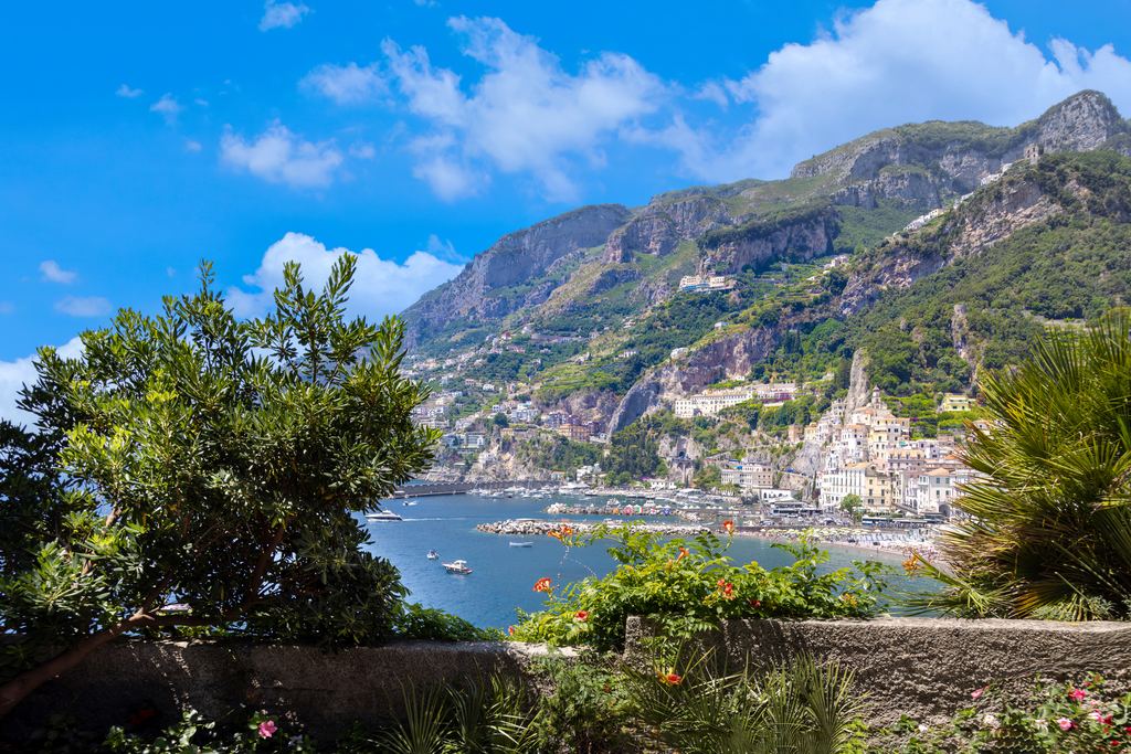 View of Amalfi and its coast seen through garden greenery