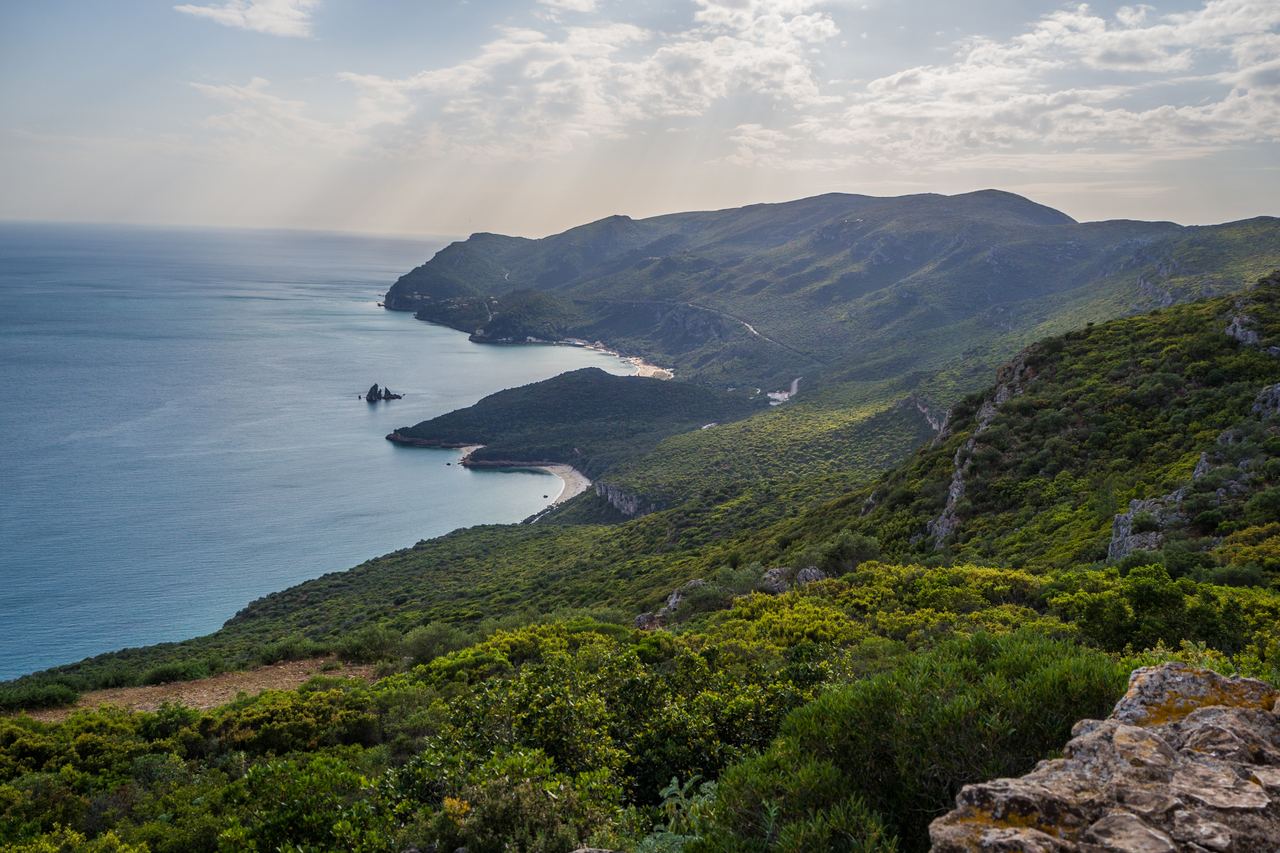 Forested hills of the Serra da Arrábida dropping to the Atlantic south of Lisbon, Portugal