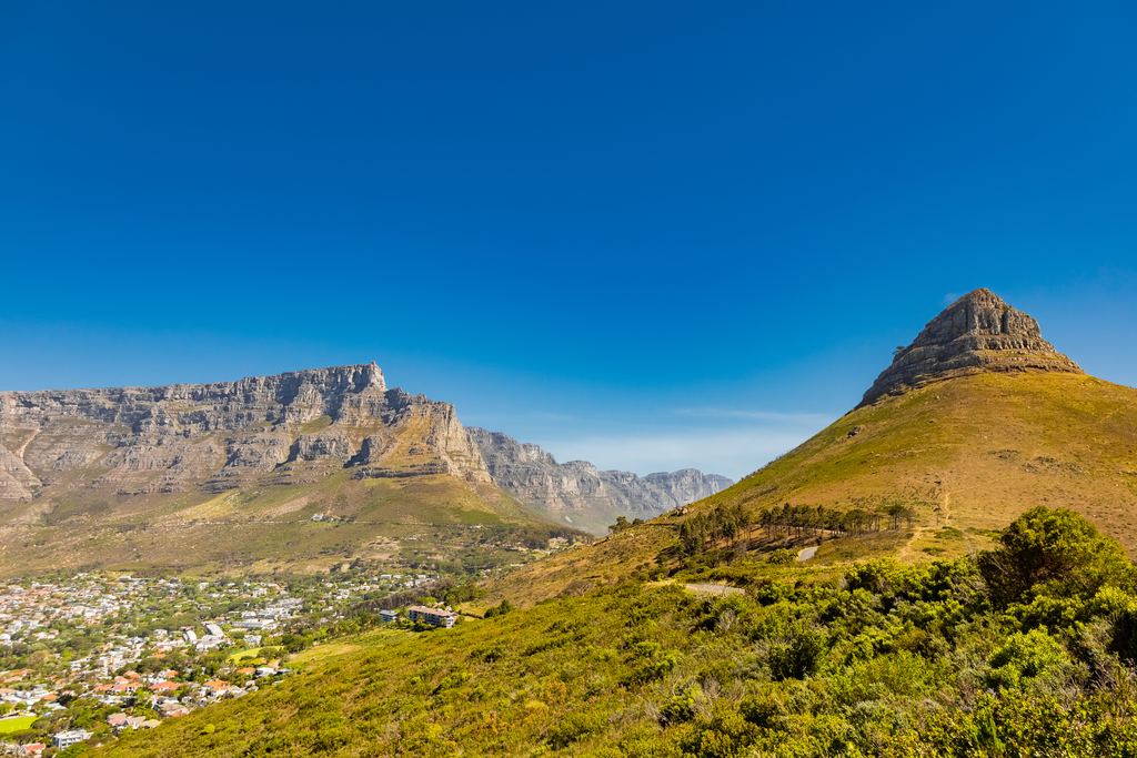 Aerial view of Cape Town with its rocky mountain range behind the city