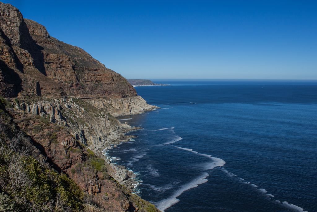 Mountain cliffs dropping to the ocean along the coast near Cape Town, South Africa