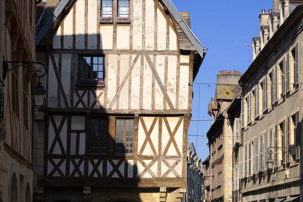 Half-timbered medieval house on a street in central Dijon