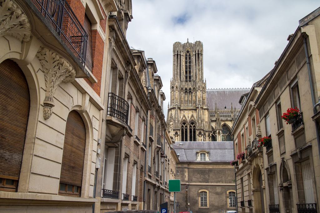 Gothic facade of Notre-Dame de Reims seen from a side angle