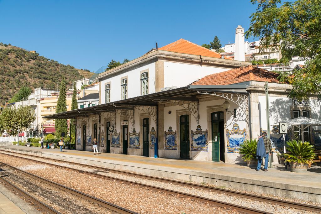 Pinhão railway station with blue azulejo panels on the platform building