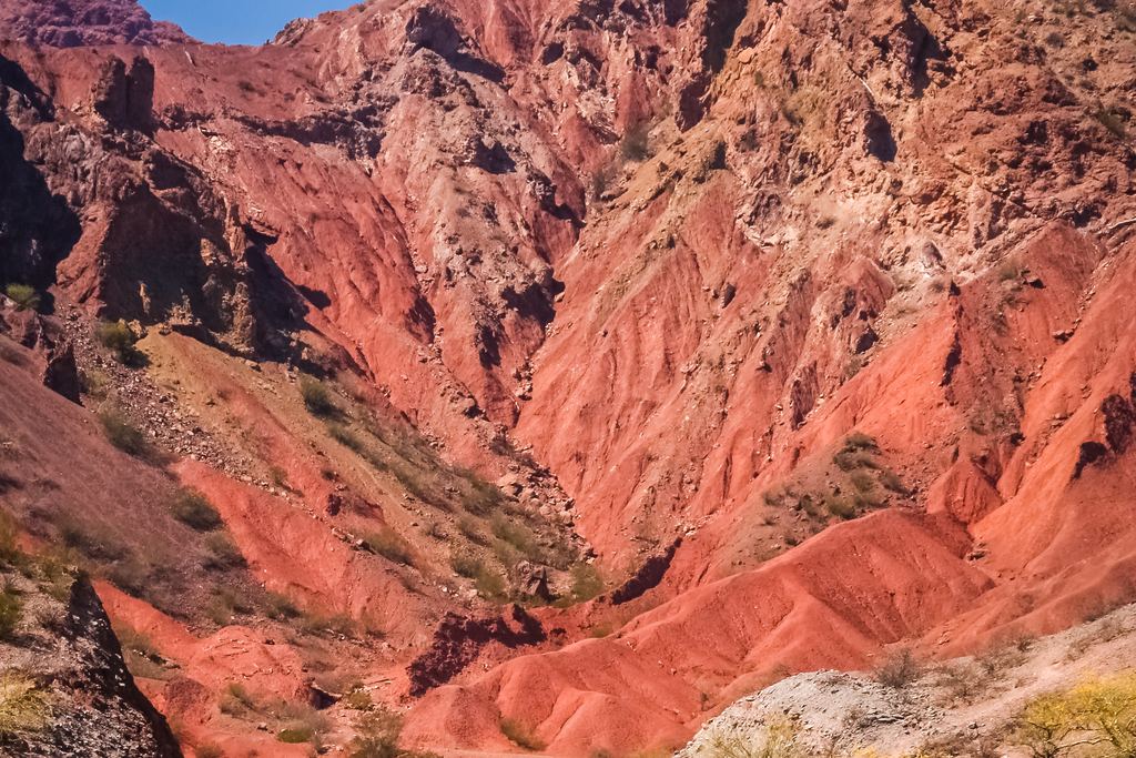 A winding road through red rock canyons on the way to Cafayate in Salta