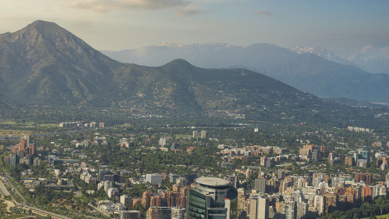 Santiago de Chile at dusk with the Andes rising behind the city