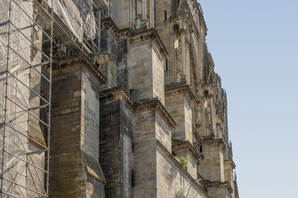 Street in Reims with the cathedral tower at the end