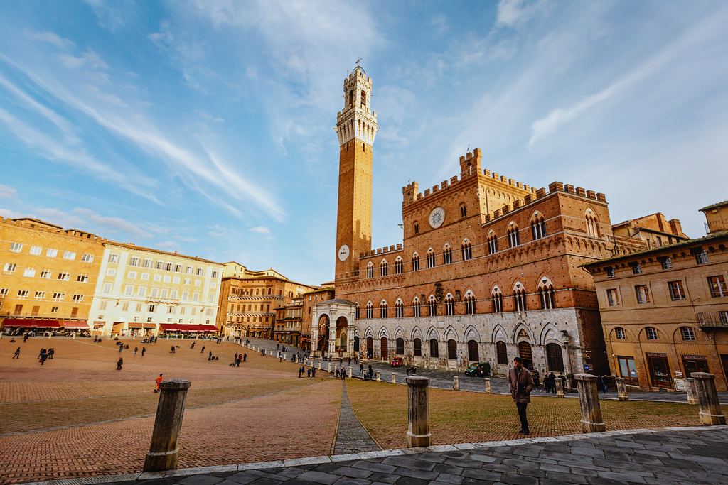 The Torre del Mangia rising over Piazza del Campo in Siena